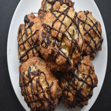 Coconut, Cherry and Chocolate Rock Buns on a white plate
